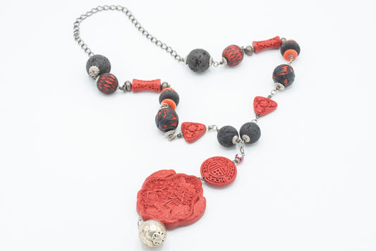 Collana in cinabro, argento, corallo e lava